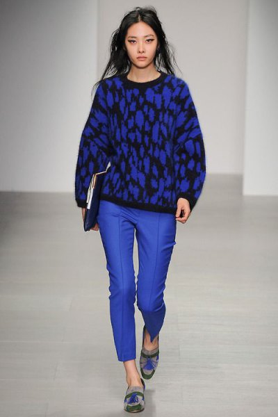 black knitted sweater with royal blue wax pants and graphic evening shoes