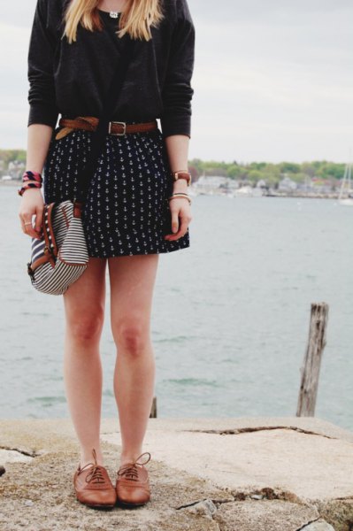 white blouse with mini-printed skater skirt with belt and brown leather shoes