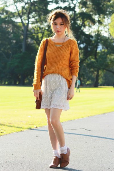 green, knitted sweater with white lace shorts and brown oxford suede shoes