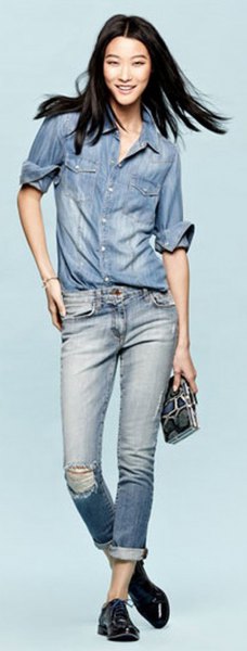 Chambray shirt with blue torn jeans with cuffs