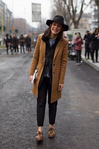 brown longline blazer with black slim fit trousers and floppy hat