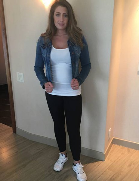 blue denim jacket with white, form-fitting tank top and leggings