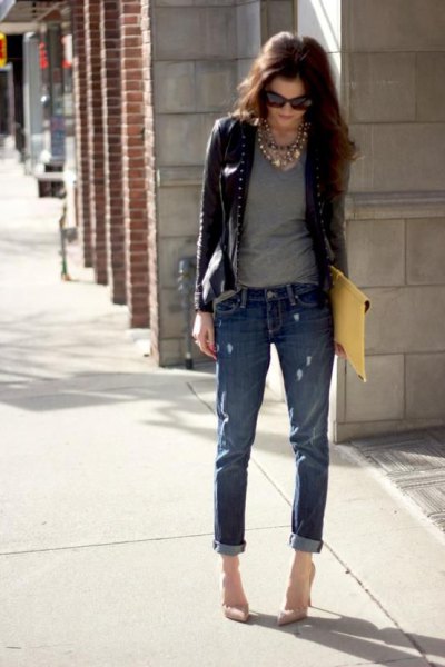 short leather riding jacket with gray t-shirt and cuff jeans