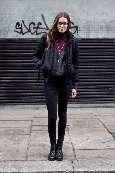 black windbreaker with gray mock-neck sweater and skinny jeans