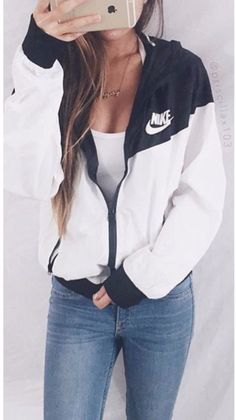 black windbreaker with white tank top with low scoop neck