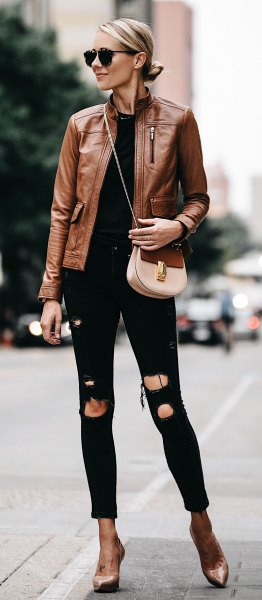 brown leather motorcycle jacket with torn black skinny jeans with cuffs