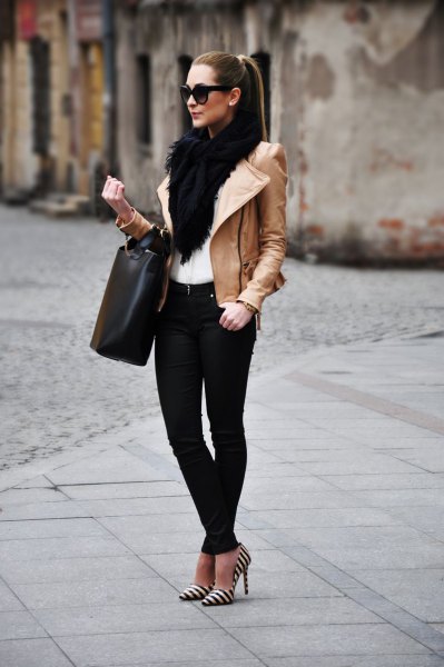 black faux fur scarf with brown leather jacket and striped heels