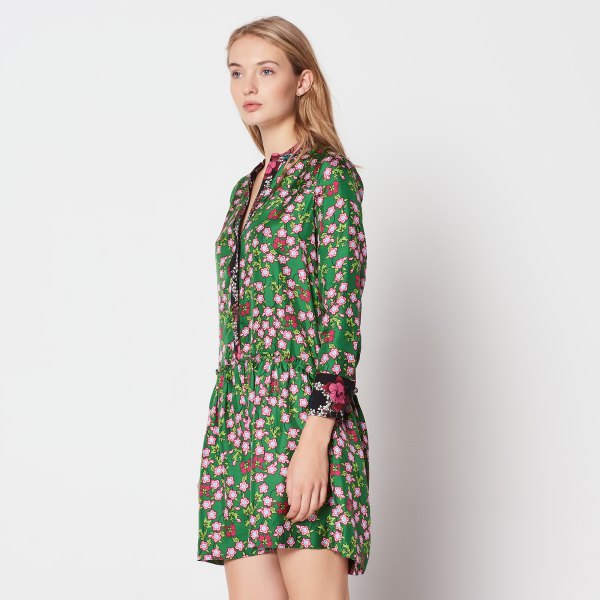 green and white long-sleeved mini dress with floral pattern