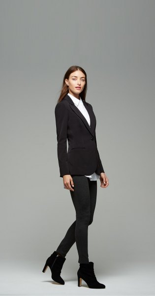 white shirt with buttons, black blazer and ankle boots with heels