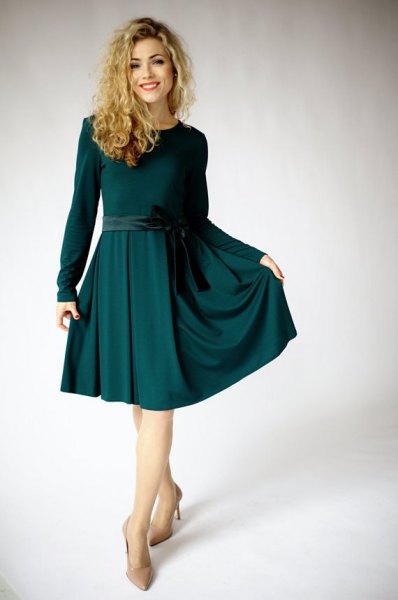 Long sleeve dark green cut and flared midi dress with light pink heels