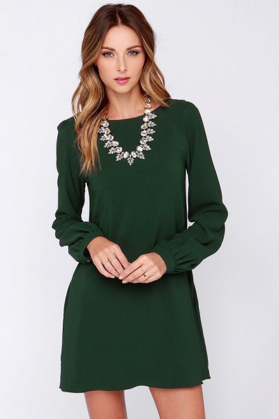 Long sleeve mini dress with a silver statement chain