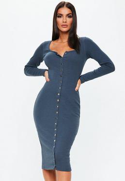 Dark blue, form-fitting long sleeve dress with buttons