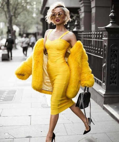 yellow sleeveless, low-cut midi bandage dress with faux fur coat