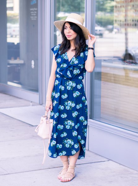 Navy blue midi dress with floral pattern and V-neck and strappy sandals
