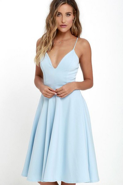 Light blue dress with a deep v-neck and flared dress