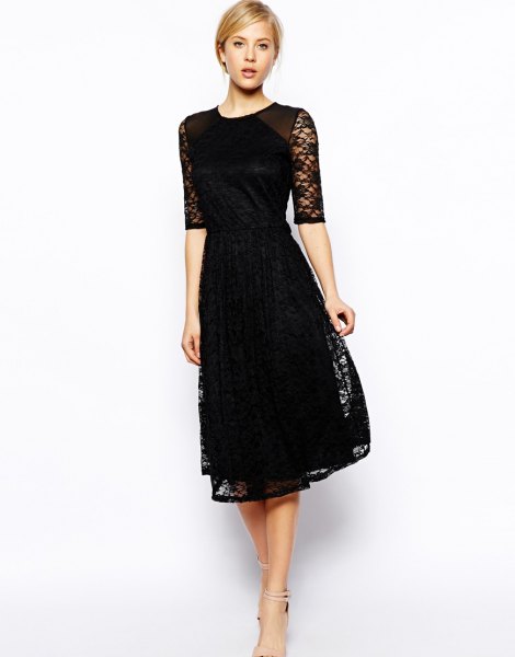 black dress with half sleeves and flared lace dress