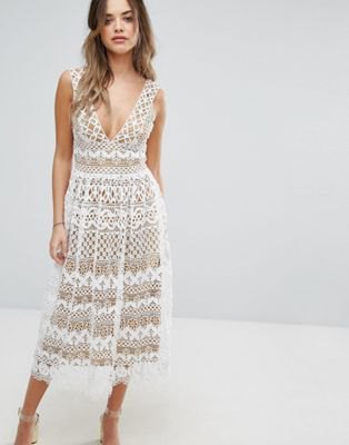 white midi dress and flared lace dress with deep V-neck