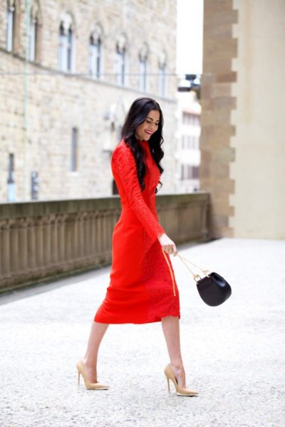 red long-sleeved midi shift dress with pink high heels with pointed toes