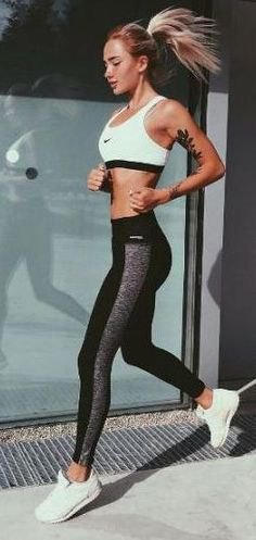 white sports bra top with black and gray running pants and sneakers