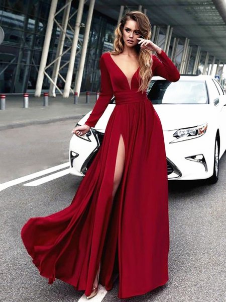 red maxi dress with deep V-neck and long sleeves and high slit