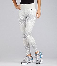 white and light gray patterned Nike running pants with black, form-fitting T-shirt