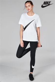 white oversized t-shirt with black Nike running pants