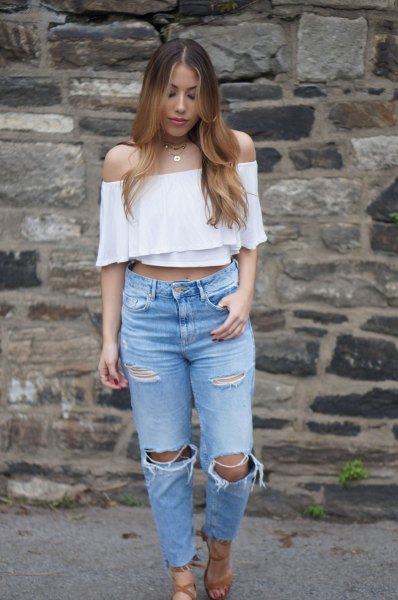 white, off-shoulder, short-cut blouse with torn mom jeans