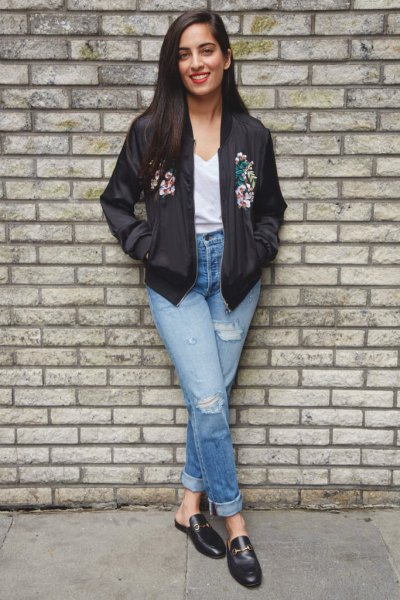 black floral bomber jacket with white V-neck t-shirt and loafers