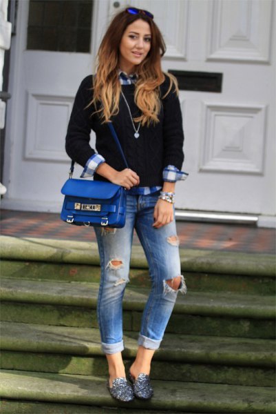 black knit sweater with checkered boyfriend shirt and torn jeans
