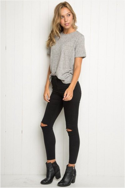 gray, partly hidden, oversized t-shirt with black, high-rise skinny jeans