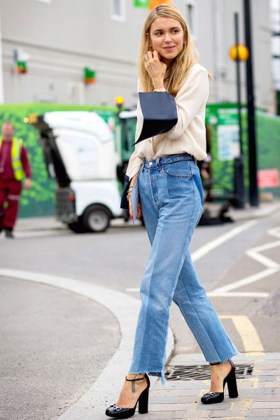 white sweater with blue high waisted mom jeans