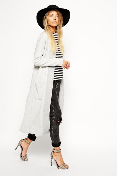 black floppy hat with white maxi cardigan and striped t-shirt