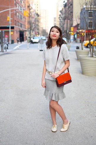 light gray sweater with matching knee-length skirt with frilled hem