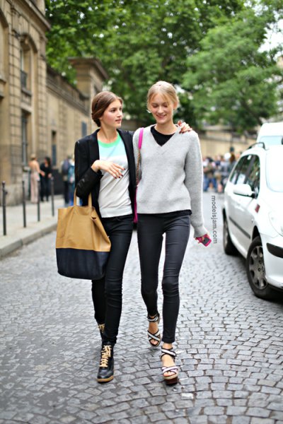 gray v-neck sweater with black crew-neck t-shirt and dark jeans