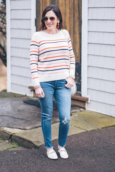 white knitted sweater with blue jeans and loafers