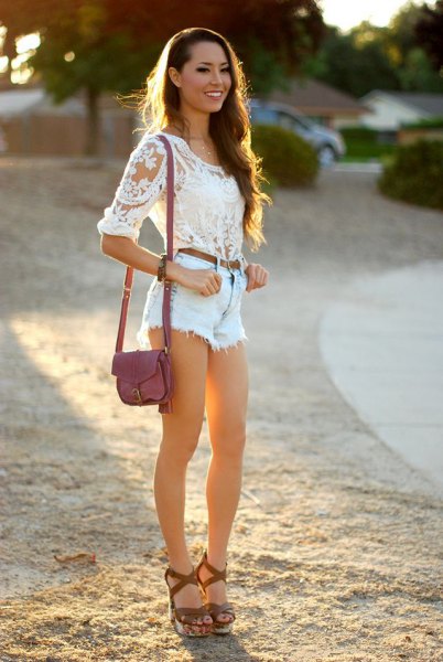 white lace blouse with light blue denim shorts and sandals