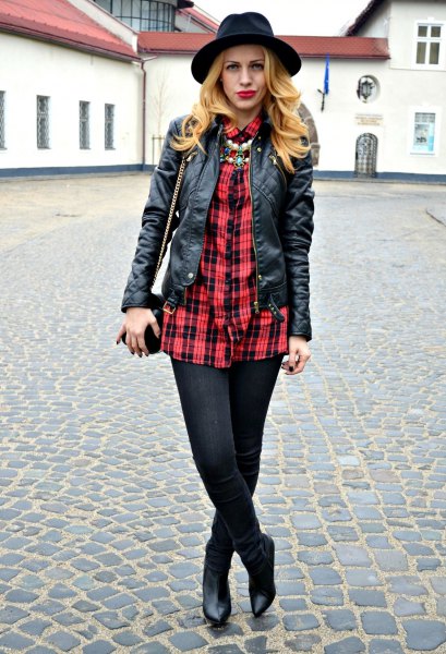 red and black oversized shirt with leather jacket and felt hat