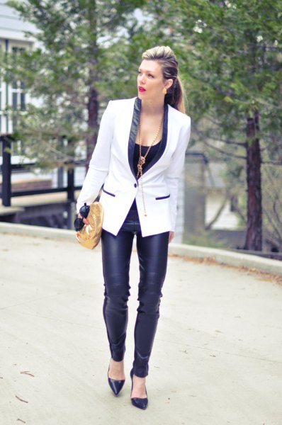 white and black blazer with narrow leather pants