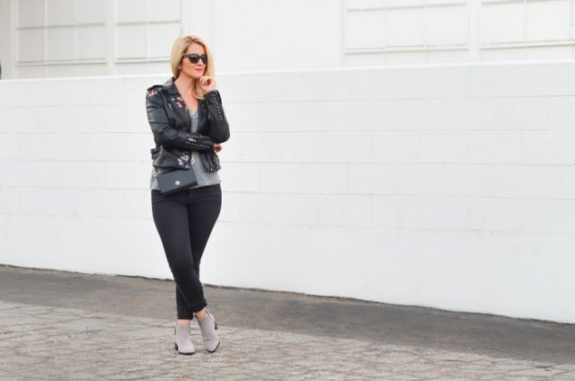 black leather jacket with scoop t-shirt and gray ankle boots
