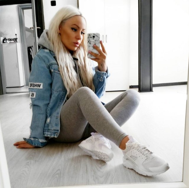 blue denim jacket with light gray leggings and running shoes