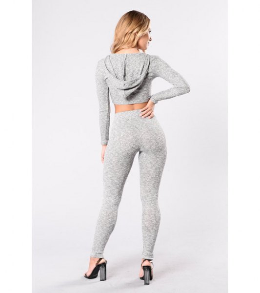 gray, short-cut hoodie with matching leggings and high-heeled heels