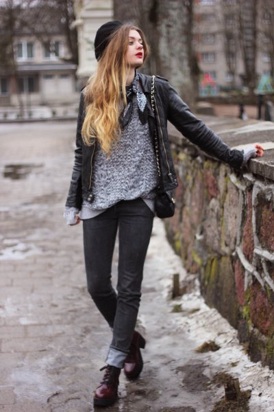 gray sweater with black leather jacket and cuff jeans