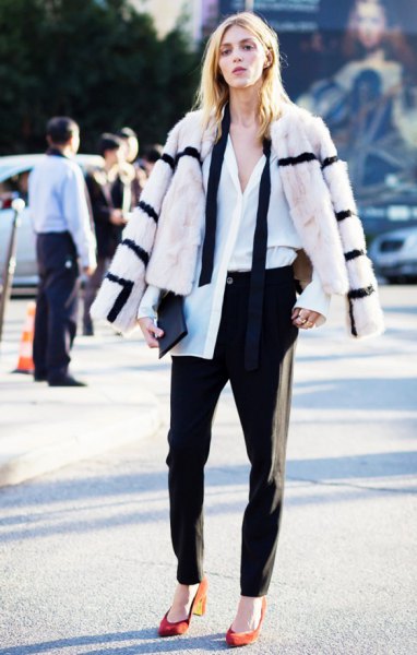 white-black striped faux fur coat with black chinos and orange heels