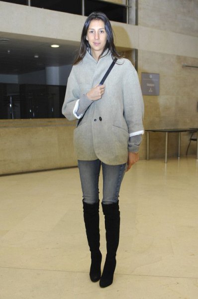 gray wool coat with light blue skinny jeans and black boots
