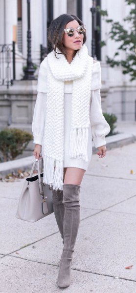 white fringed scarf with matching sweater dress and gray over the knee boots