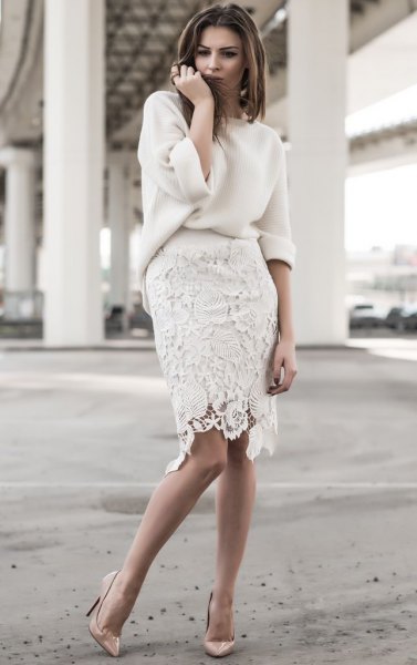 white, chunky sweater with knee-length lace skirt