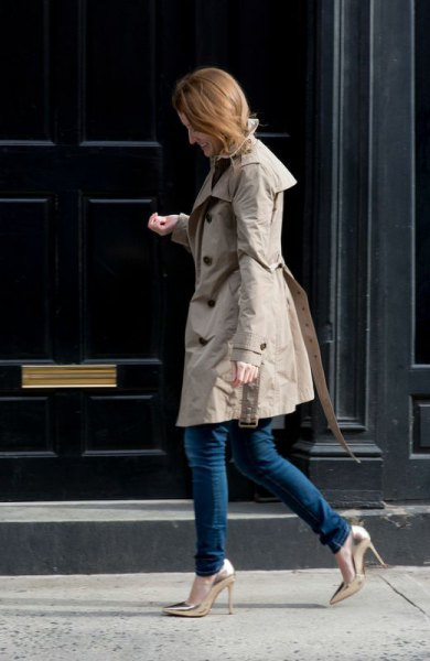 gray longline parka jacket with dark skinny jeans and golden heels