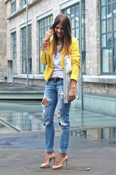 yellow blazer with blue torn boyfriend jeans with gold evening shoes