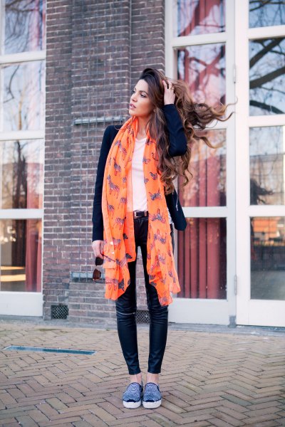 long chiffon scarf printed in orange with black blazer and skinny jeans