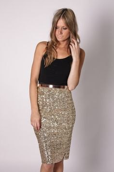 black tank top with scoop neck and knee-length sequin skirt made of gold